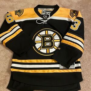 Youth s/m Bruins Brad Marchand jersey. White laces. In excellent condition.